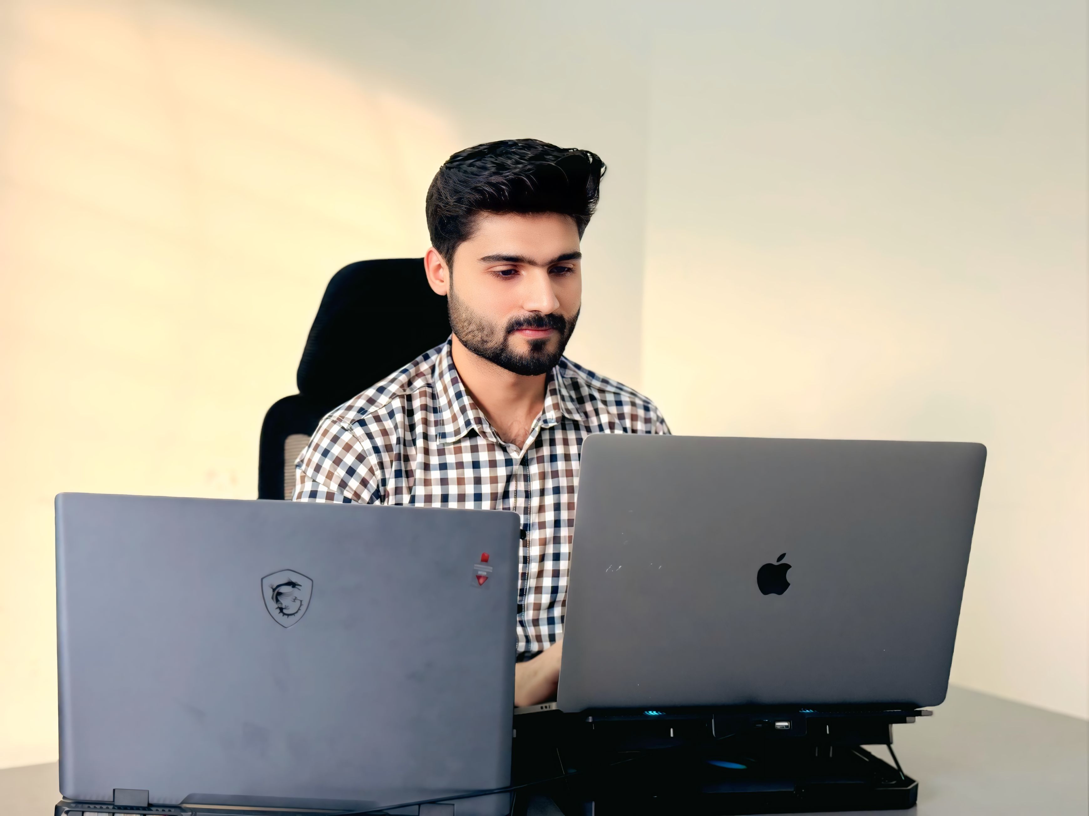 Muhammad Hamza with macbook