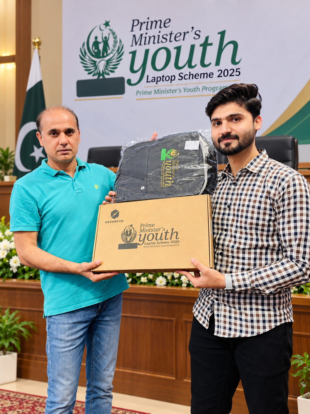 Muhammad Hamza receiving a laptop under the Prime Minister's Youth Laptop Scheme 2025