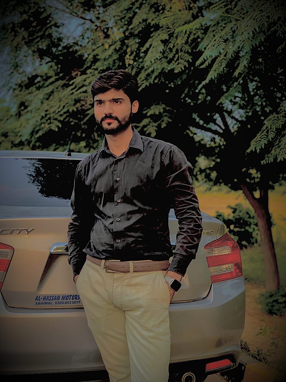 Muhammad Hamza smart-casual black shirt outdoor portrait